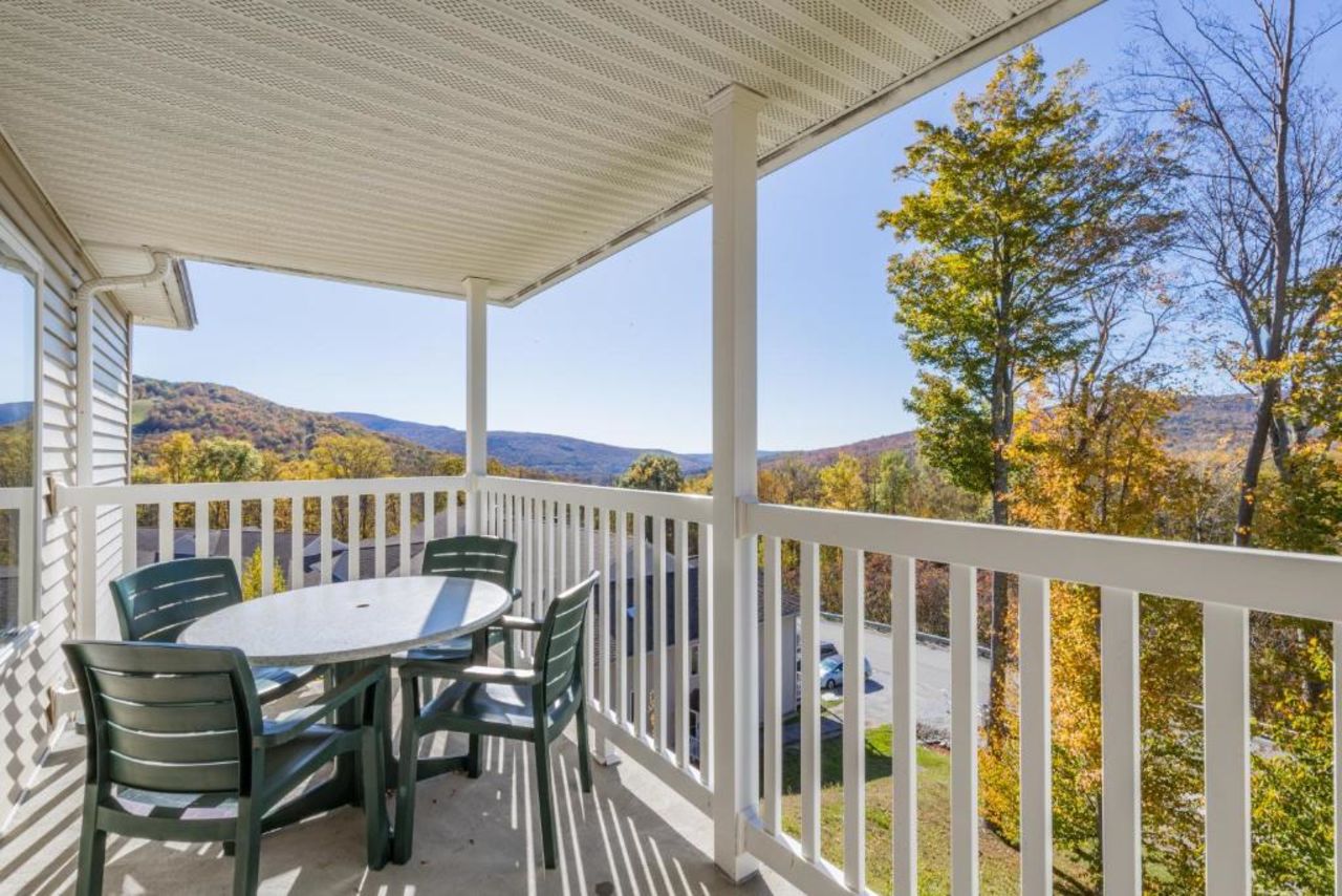 balcony in the mountains overlooking fall leaves